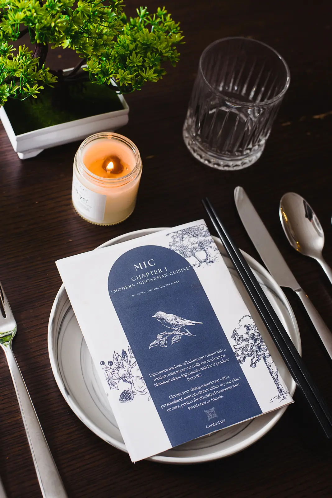 Chef plating an elegant dish in warm evening light